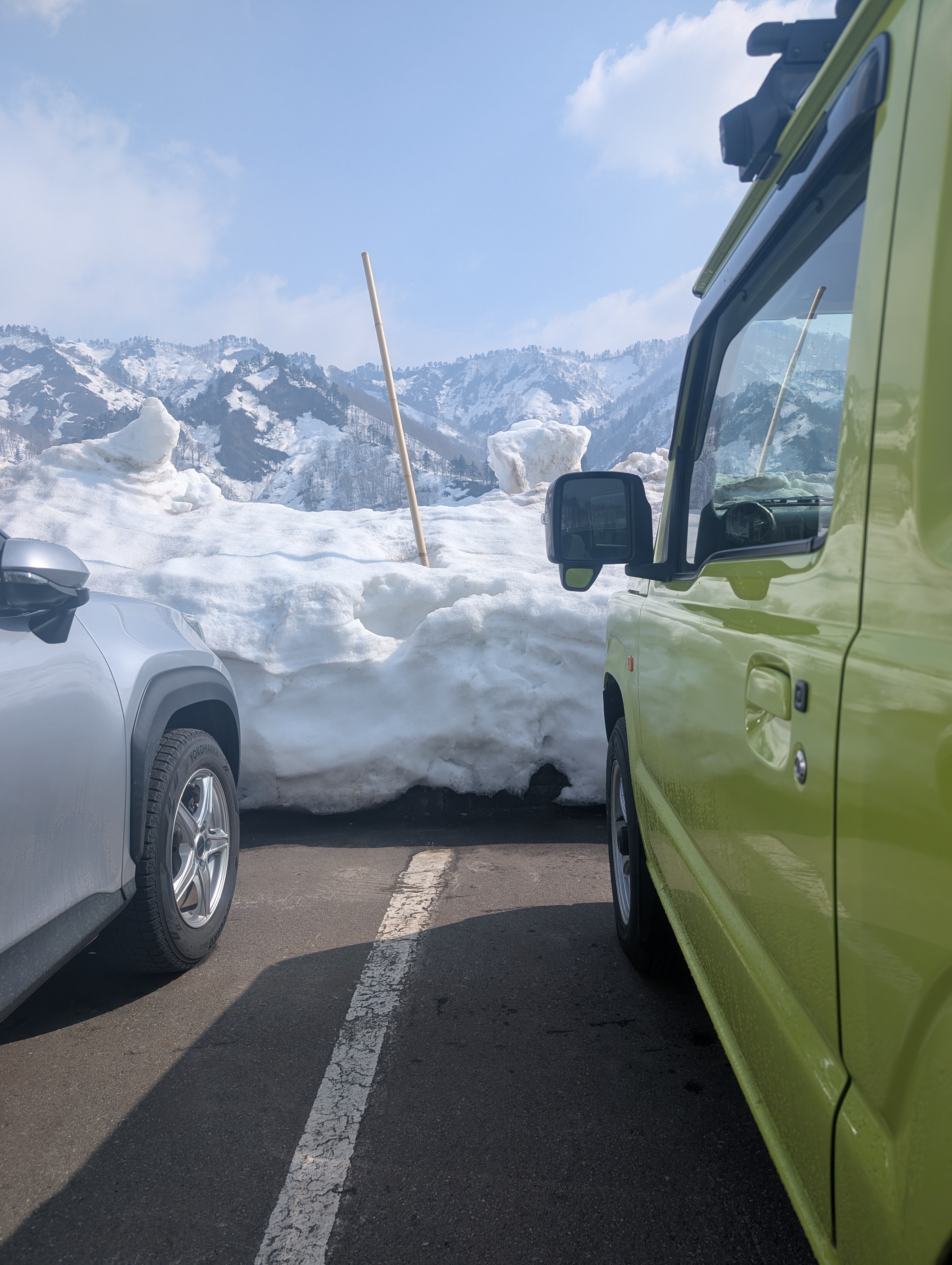 The parking area at Okutadami Maruyama surrounded by deep spring snow